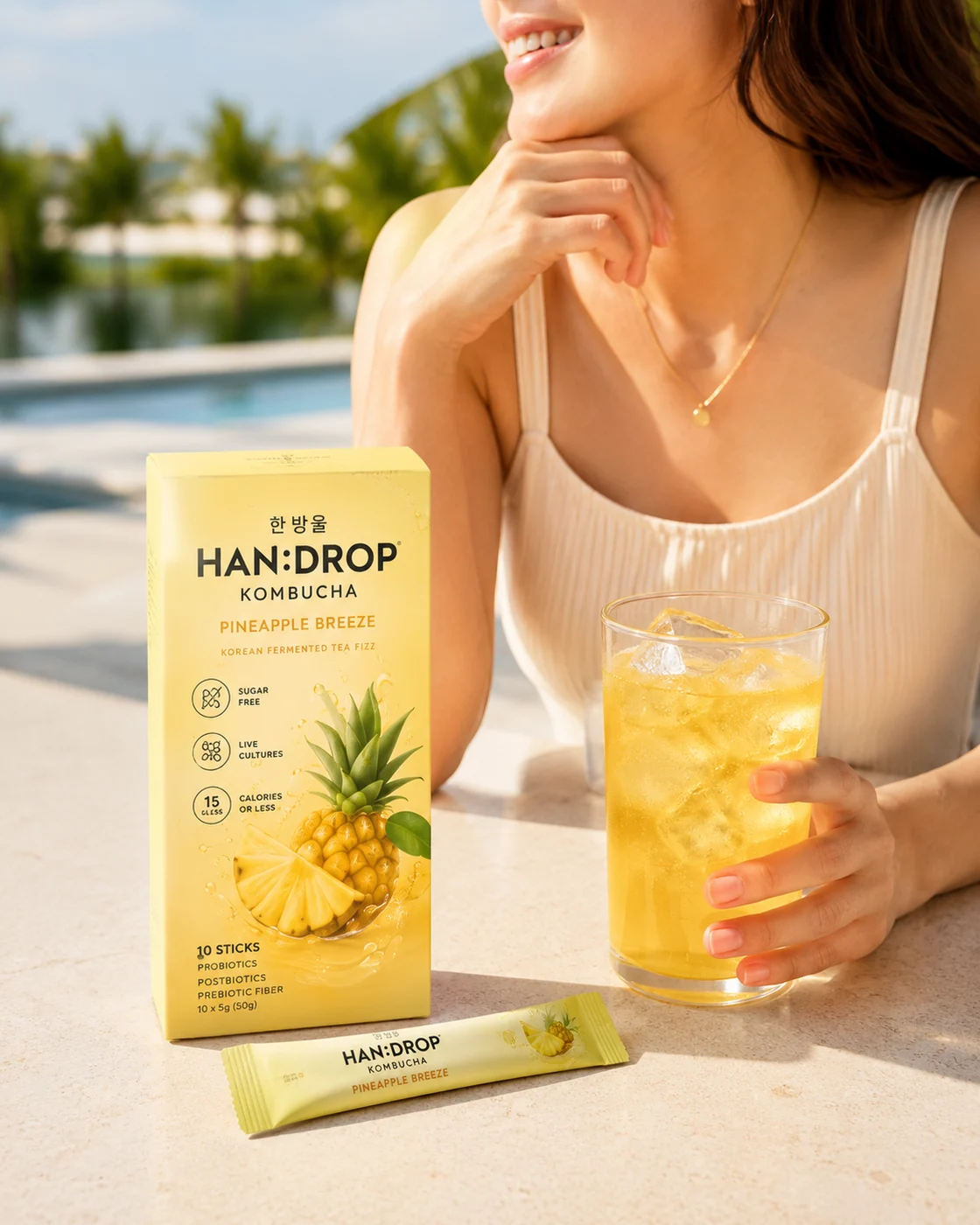 Pineapple Breeze kombucha by the pool