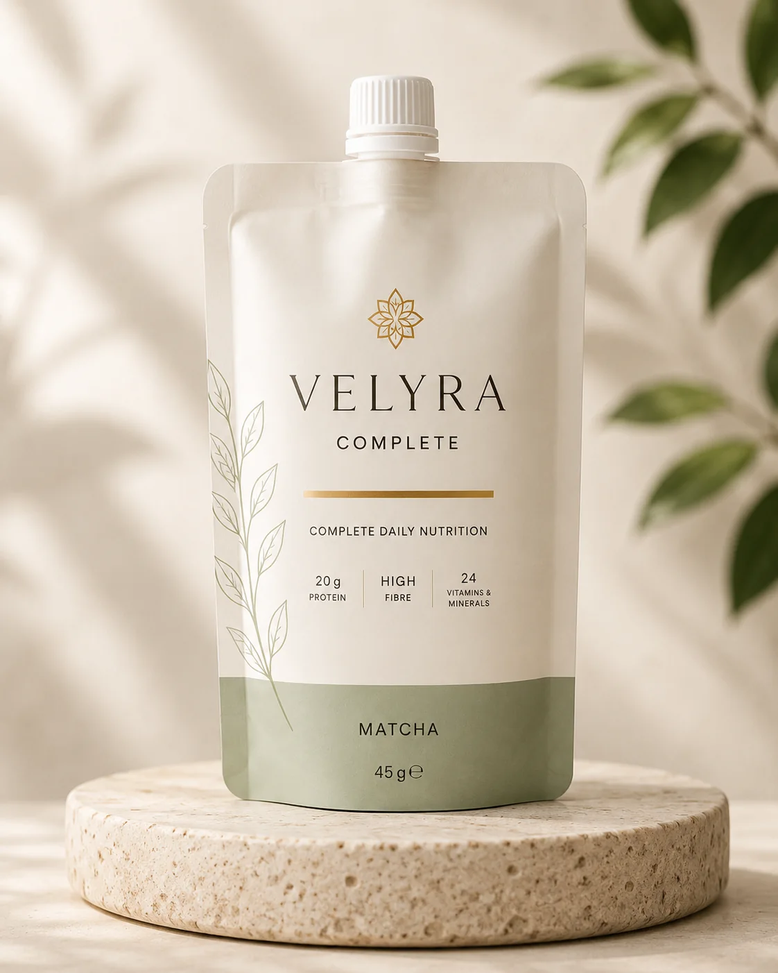 VELYRA COMPLETE Matcha pouch on a stone podium